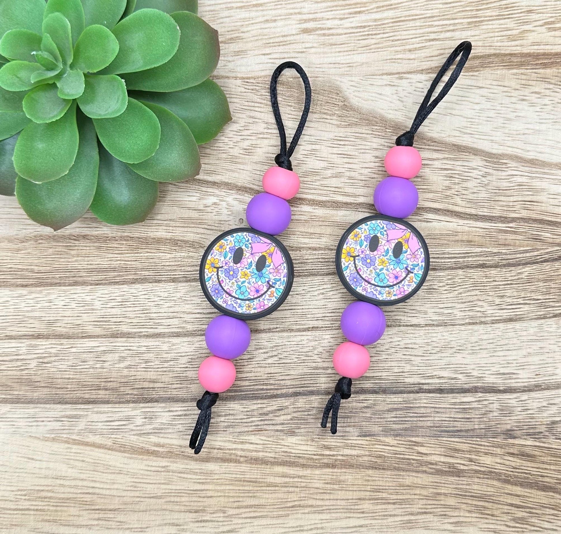 Purple Floral Smiley Zipper Pull