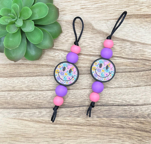 Purple Floral Smiley Zipper Pull