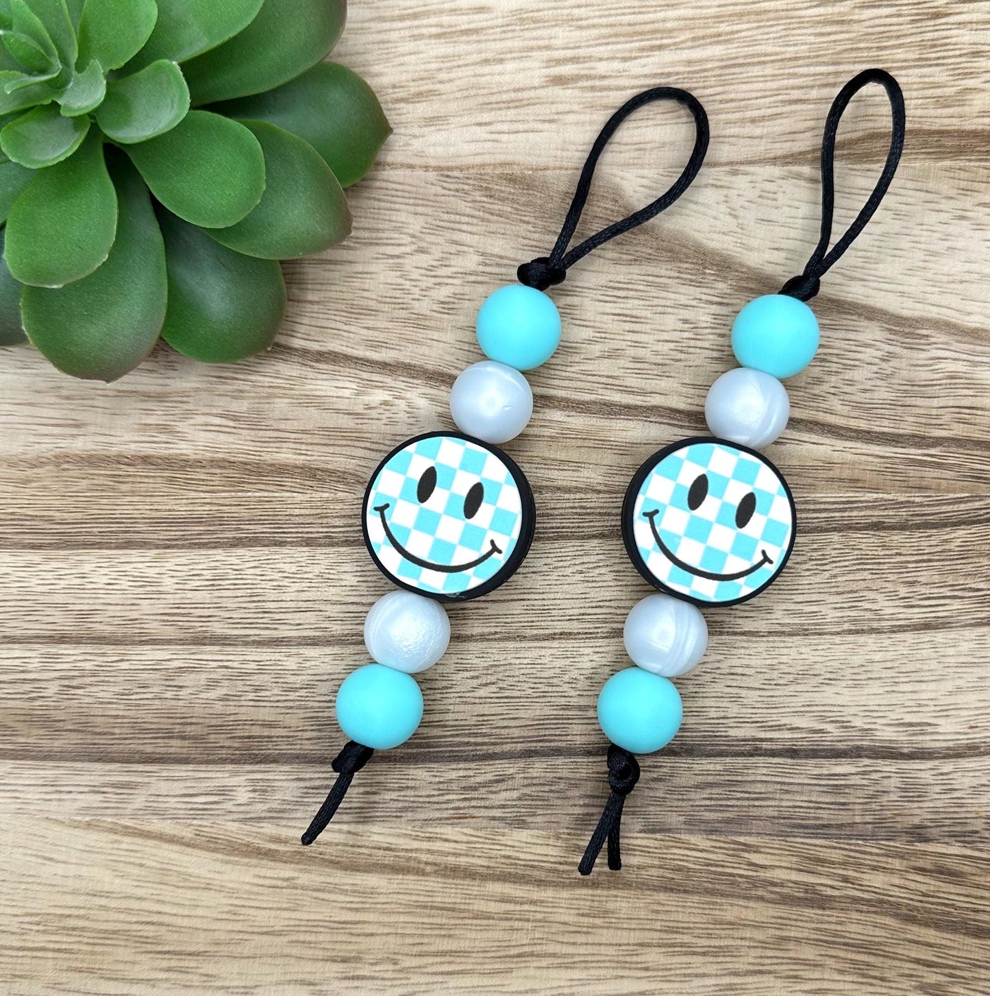 Checkered Blue Smiley Zipper Pull
